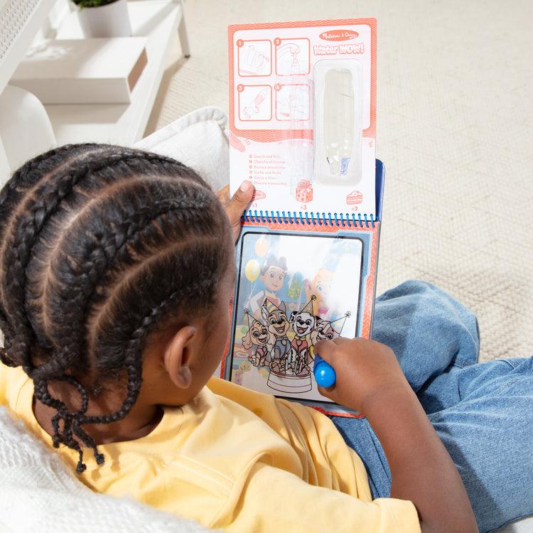 A playroom scene with The Melissa & Doug Water WOW! PAW Patrol Chase Reusable Coloring Book with Refillable Water Pen - For Ages 3+