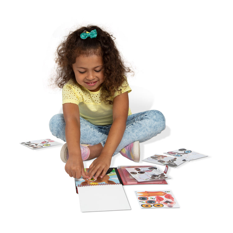 A child on white background with The Melissa & Doug On the Go Make-a-Face Reusable Sticker Pad Travel Toy Activity Book – Farm Animals (10 Scenes, 76 Cling Stickers)