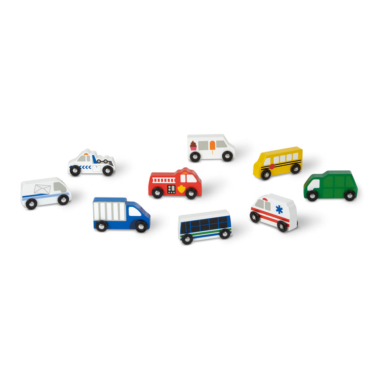 The loose pieces of The Melissa & Doug Wooden Town Vehicles Set in Wooden Tray (9 pcs)