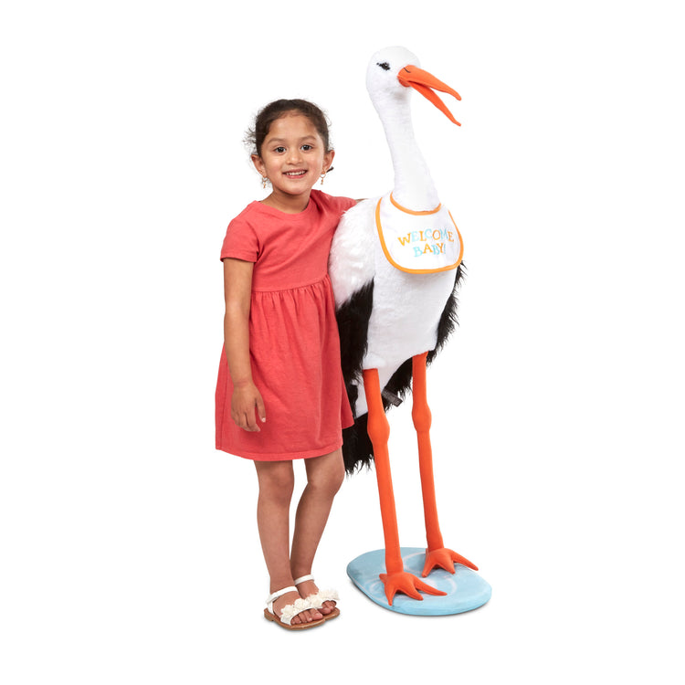 A child on white background with The Melissa & Doug Lifelike Plush Stork Giant Standing Stuffed Animal (3+ Feet Tall)