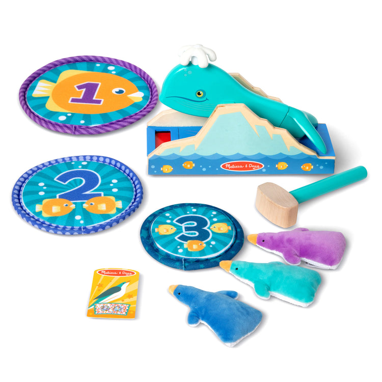 The loose pieces of The Melissa & Doug Fun at the Fair! Penguin Launch Game