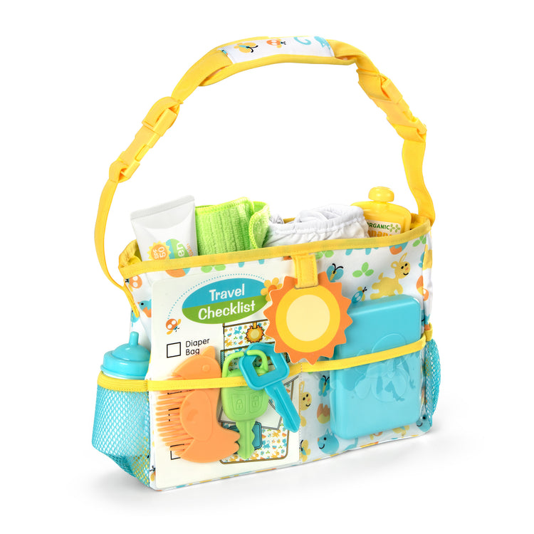 The loose pieces of The Melissa & Doug Mine to Love Travel Time Play Set for Dolls with Diaper Bag, Bottle, Sunscreen, More (17 pcs)