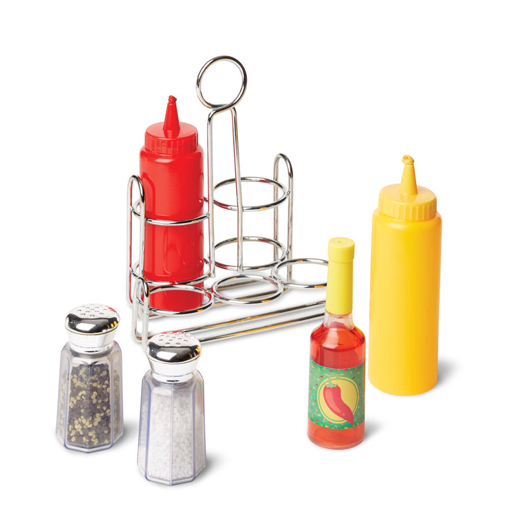 The loose pieces of The Melissa & Doug Condiments Play Set (6 pcs) - Play Food, Stainless Steel Caddy