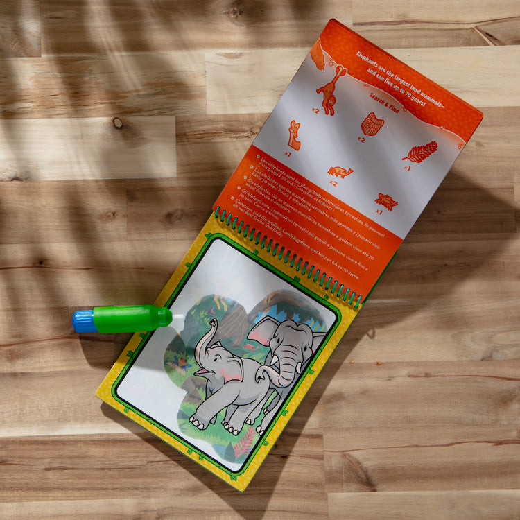 A playroom scene with The Melissa & Doug On the Go Water Wow! Reusable Water-Reveal Coloring Activity Pad Travel Toy for Boys and Girls– Jungle