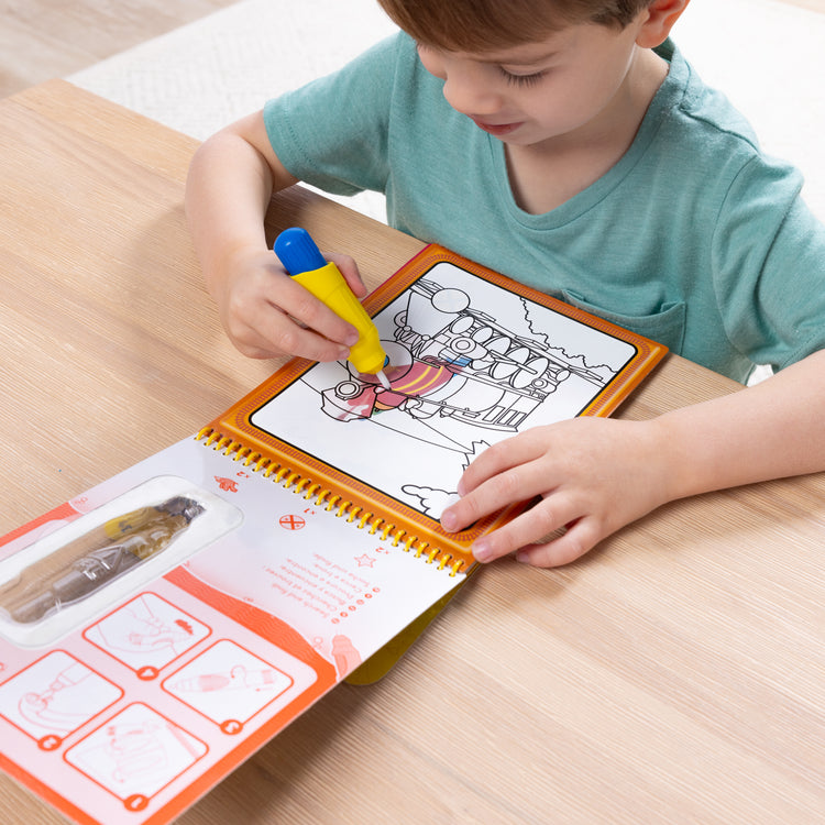 A kid playing with The Melissa & Doug Water WOW! 2-Pack – Animals, Vehicles Water-Reveal Travel Activity Pads 