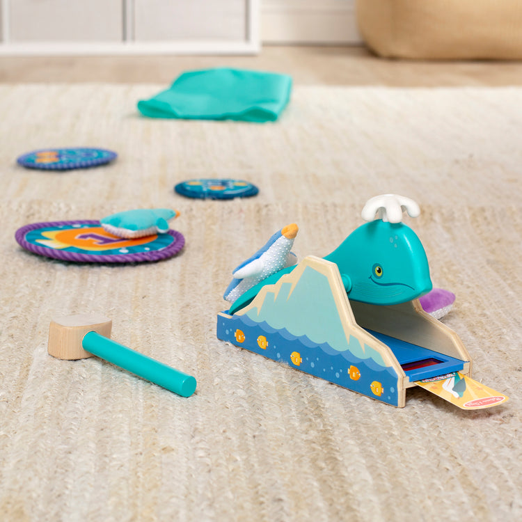 A playroom scene with The Melissa & Doug Fun at the Fair! Penguin Launch Game