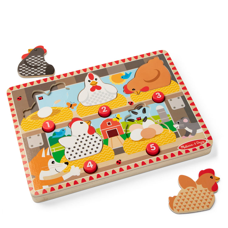 The loose pieces of The Melissa & Doug Happy Hens Push to Pop Wooden Puzzle, Montessori-Inspired Toddler Puzzles with Magnetic Pieces and Colorful Puzzle Board, Preschool Toys for Girls & Boys 18 months+