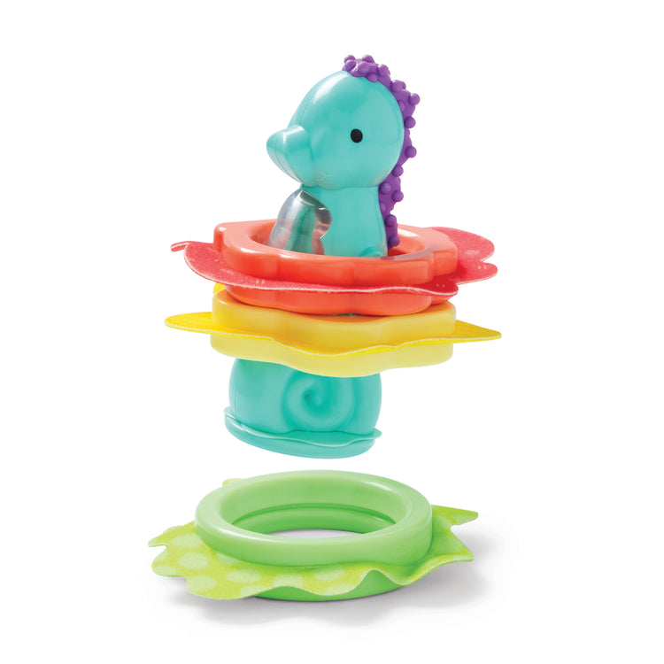The loose pieces of The Melissa & Doug Ocean Waves Press & Stack Seahorse Stacking Toy with 3 Sensory Rings - Rattle for Babies 10 Months+