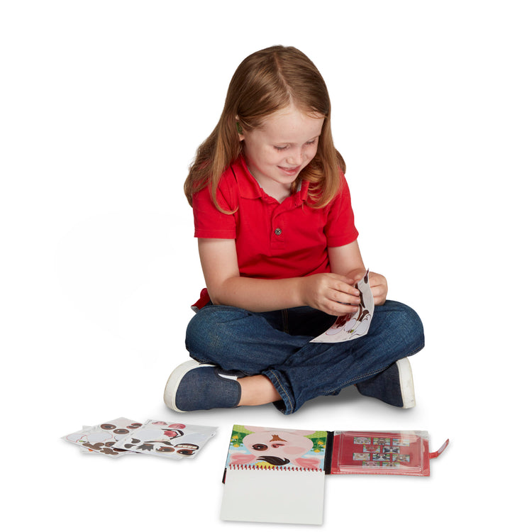A child on white background with The Melissa & Doug On the Go Make-a-Face Reusable Sticker Pad Travel Toy Activity Book – Farm Animals (10 Scenes, 76 Cling Stickers)