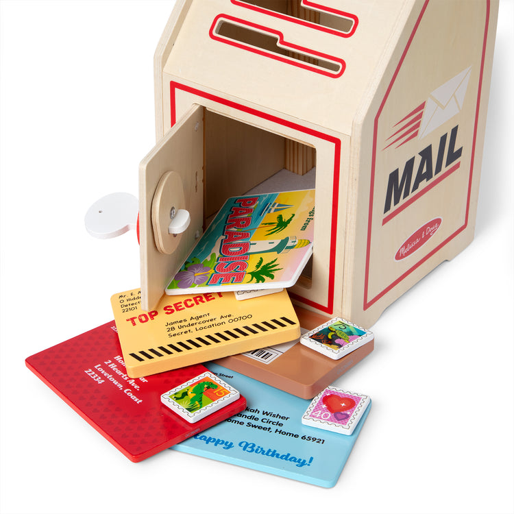 The loose pieces of The Stamp and Sort Mailbox Play Set