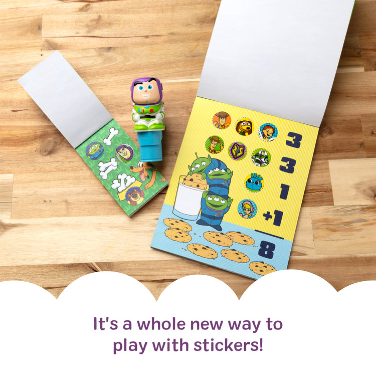 A kid playing with The Melissa & Doug Sticker Wow!™ Disney Buzz Lightyear Bundle: 24-Page Activity Book, Refillable Sticker Stamper, Mini Pad, 500 Stickers, Arts and Crafts for Kids Ages 3+
