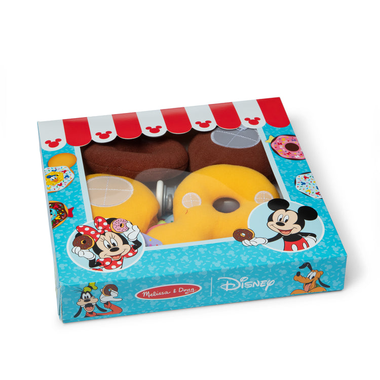 The loose pieces of The Melissa & Doug Disney Fill and Top Donut Play Set with 4 Squishy Donuts and Wooden Toppings - For Ages 3+