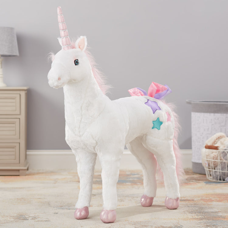 A playroom scene with The Melissa & Doug Giant Unicorn - Lifelike Plush Stuffed Animal (over 2 feet tall)