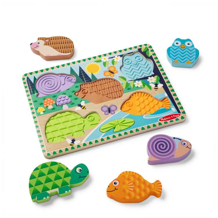 The loose pieces of The Melissa & Doug Forest Friends Touch & Feel Wooden Puzzle, 5-Piece Chunky Toddler Puzzles with Animals & Textured Silicone Puzzle Board Inlays, Preschool Toys for Girls & Boys Ages 2 and Up
