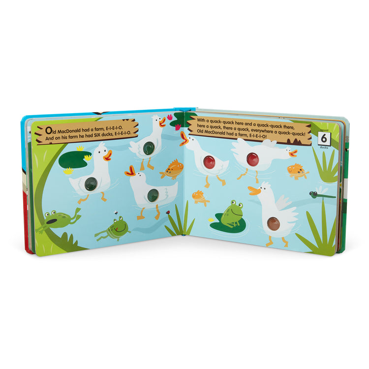 The loose pieces of The Melissa & Doug Children's Book - Poke-a-Dot: Old MacDonald’s Farm (Board Book with Buttons to Pop)