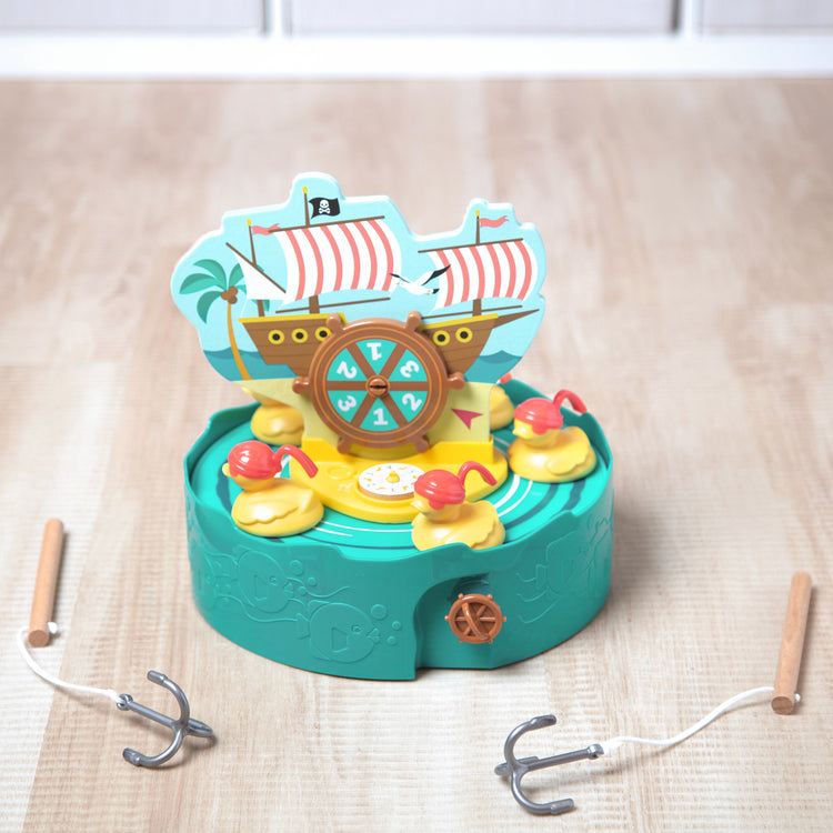 A playroom scene with The Melissa & Doug Fun at the Fair! Hook a Duck Pirate Fishing Game