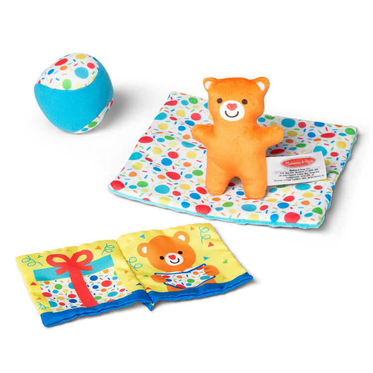 The loose pieces of The Melissa & Doug Wooden Surprise Gift Box Infant Toy (5 Pieces)