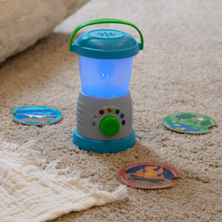 A playroom scene with The Melissa & Doug Let’s Explore™ Light & Sound Camping Lantern Play Set