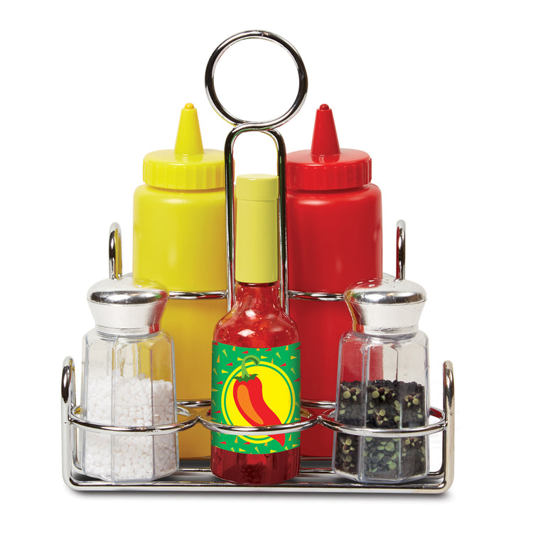 A kid playing with The Melissa & Doug Condiments Play Set (6 pcs) - Play Food, Stainless Steel Caddy