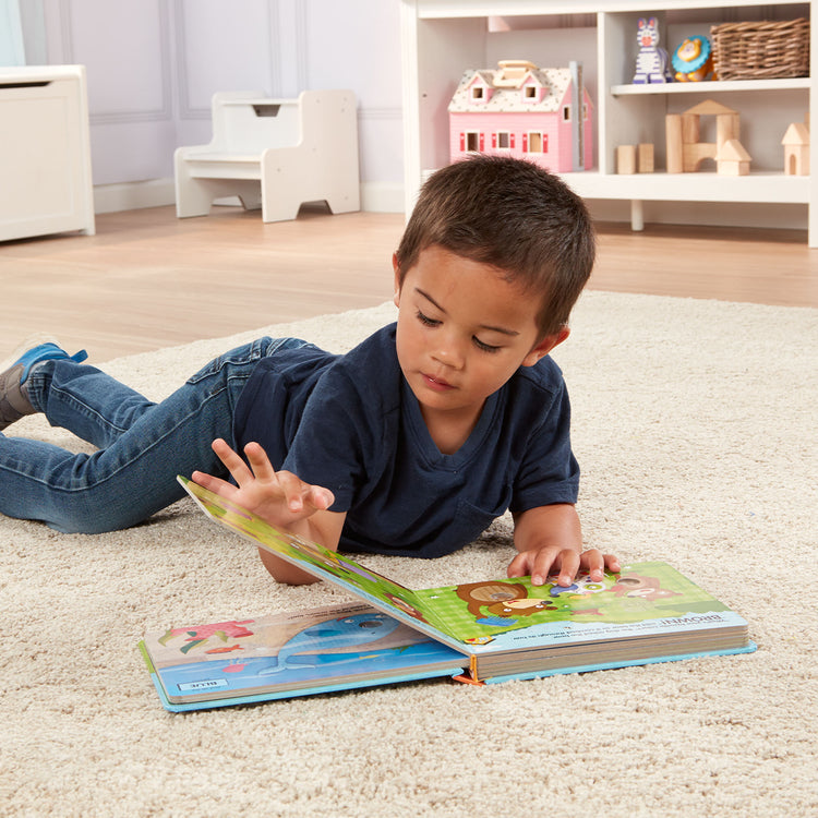A kid playing with The Melissa & Doug Children's Book - Poke-a-Dot: What’s Your Favorite Color (Board Book with Buttons to Pop)