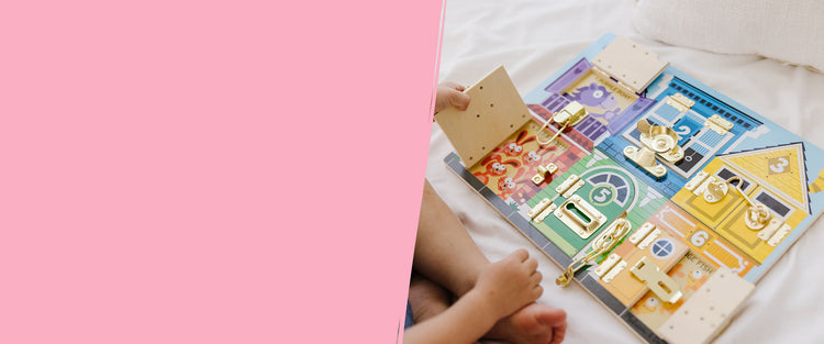 child playing with wooden latches toy