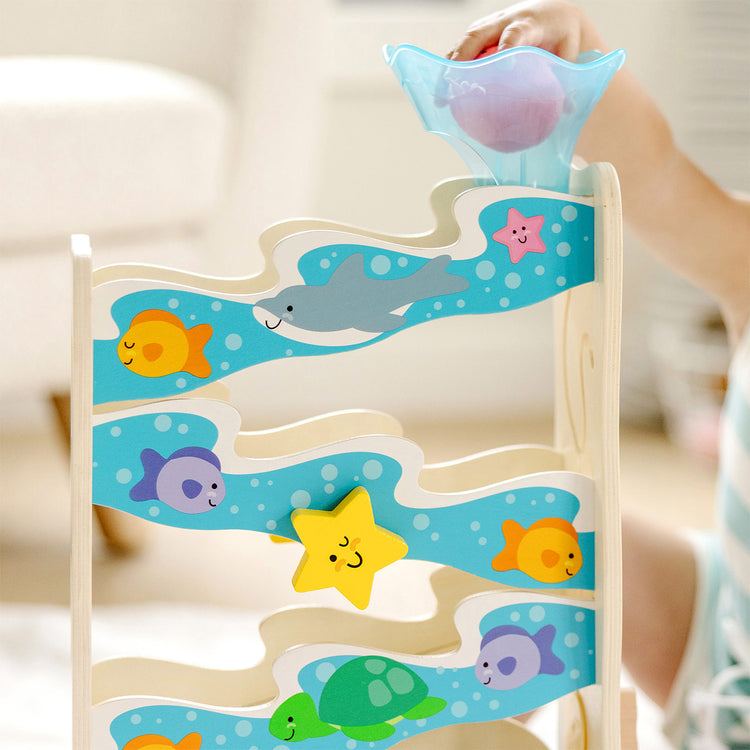 child playing with ocean toy