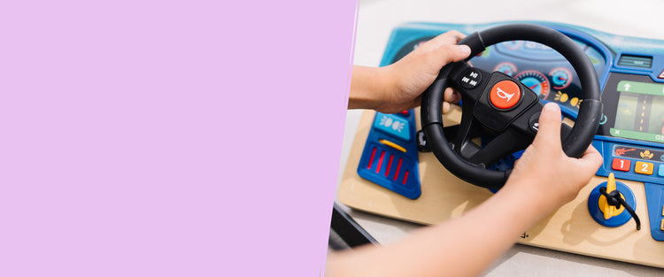 Child playing with the Vroom & Zoom Dashboard
