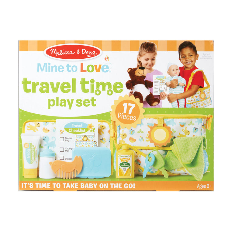 The front of the box for The Melissa & Doug Mine to Love Travel Time Play Set for Dolls with Diaper Bag, Bottle, Sunscreen, More (17 pcs)