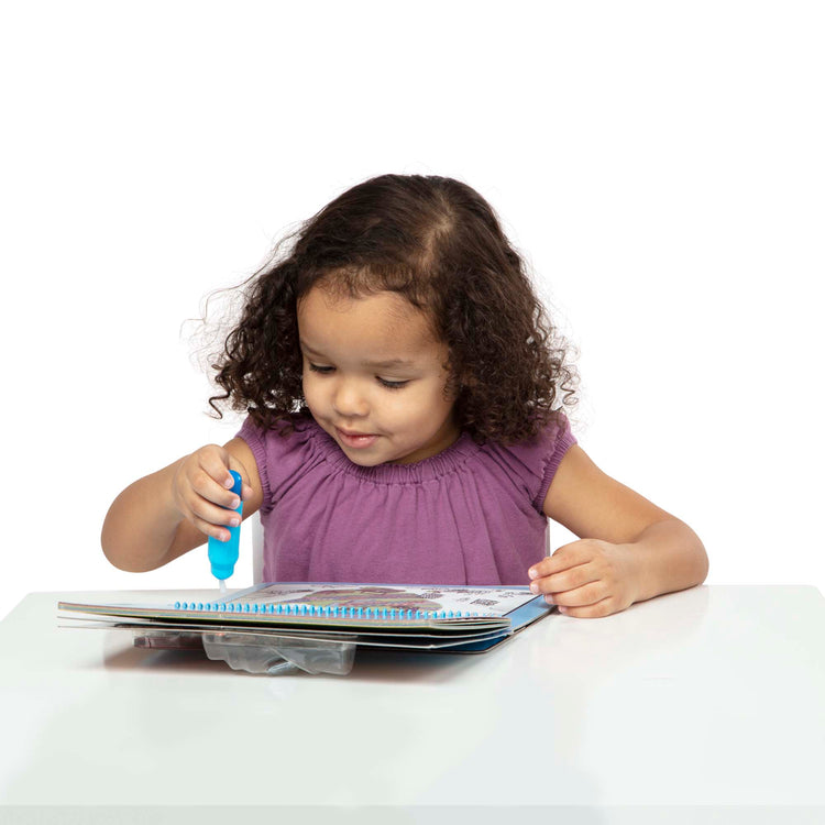 A child on white background with The Melissa & Doug On the Go Water Wow! Reusable Water-Reveal Deluxe Activity Pad – Around Town