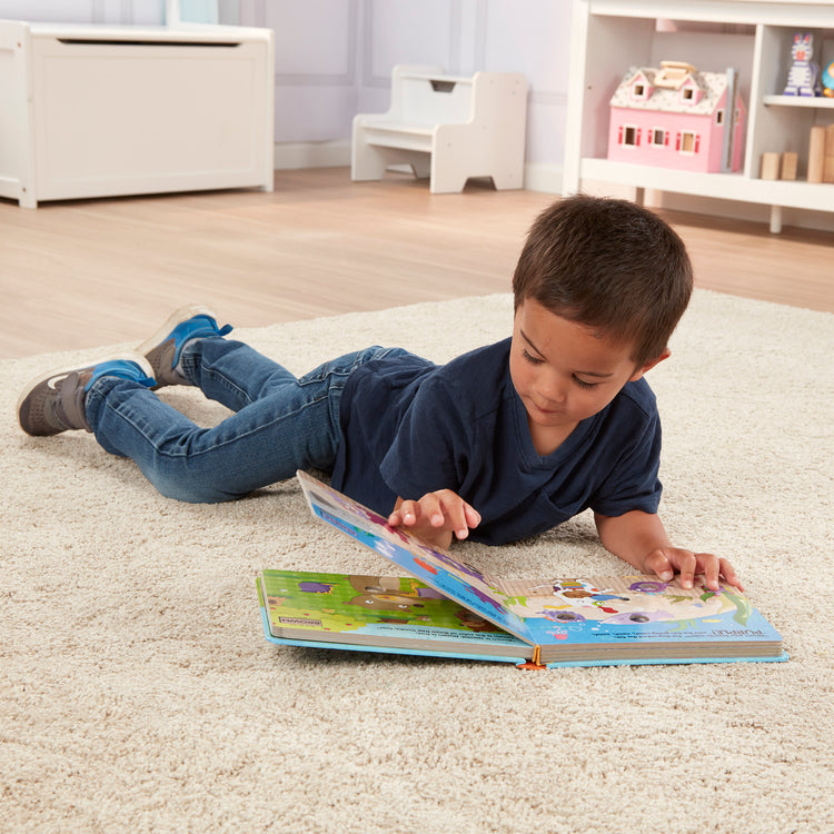 A kid playing with The Melissa & Doug Children's Book - Poke-a-Dot: What’s Your Favorite Color (Board Book with Buttons to Pop)