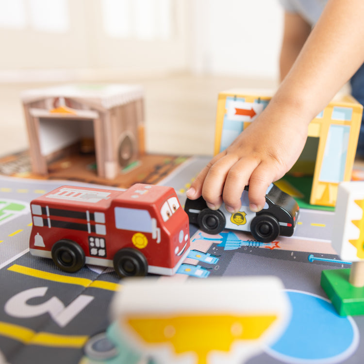 A kid playing with The Radiator Springs Nest and Stack Play Set