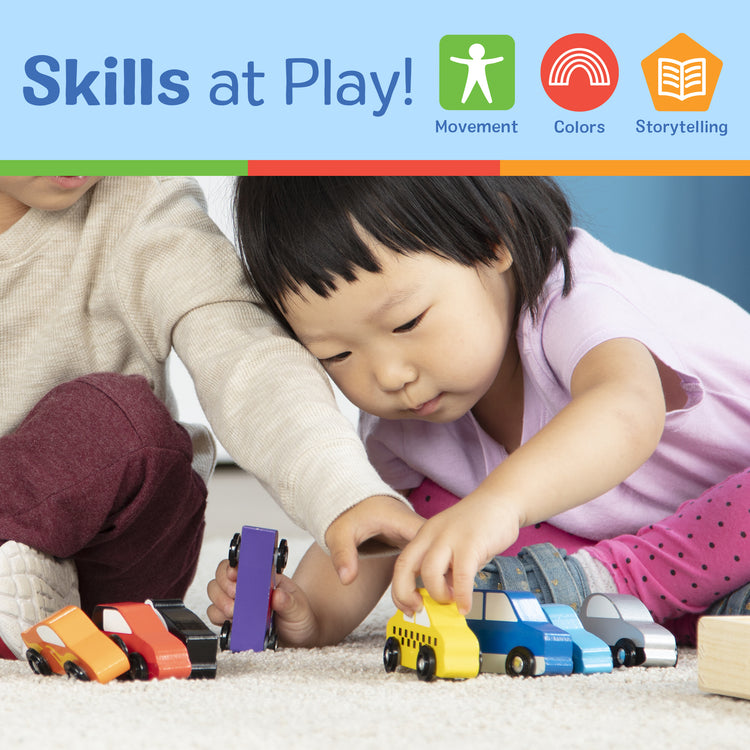 A kid playing with The Melissa & Doug Wooden Cars Vehicle Set in Wooden Tray