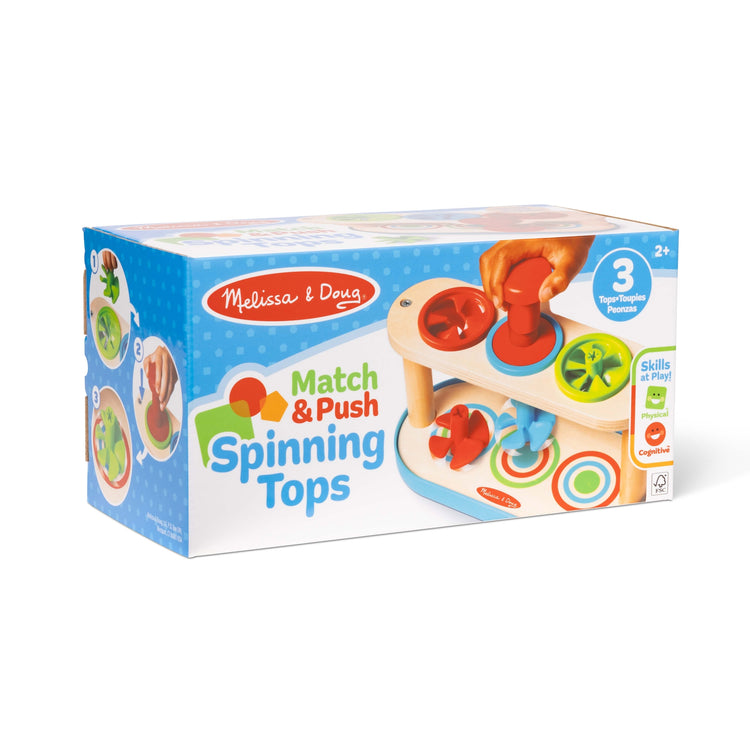 The front of the box for The Melissa & Doug Match & Push Spinning Tops Wooden Developmental Skills Learning Toy for Girls and Boys 2+ 