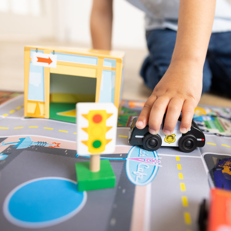 A kid playing with The Radiator Springs Nest and Stack Play Set