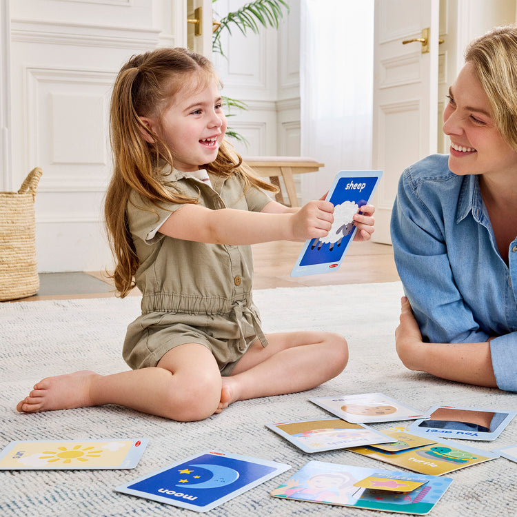 A kid playing with The Melissa & Doug® Ms. Rachel™ First Words Textured Sensory Flashcards Preschool Learning Toy for Boys, Girls