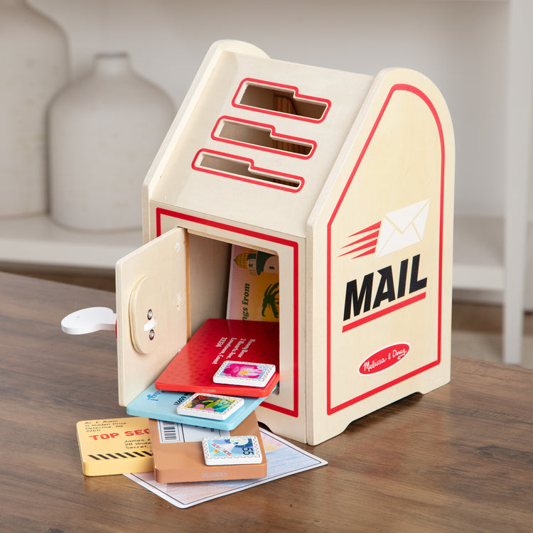 A playroom scene with The Stamp and Sort Mailbox Play Set