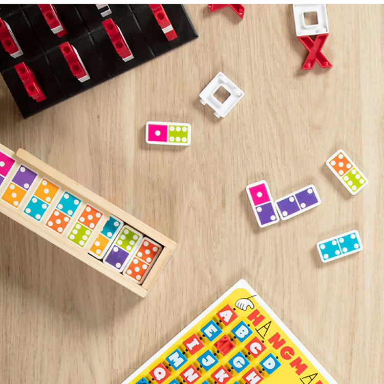 A kid playing with The Melissa & Doug Dominoes Tabletop Game with 28 Colorful Tiles in Wooden Storage Box