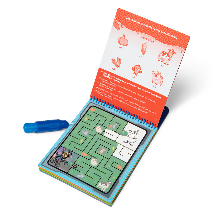 A kid playing with The Melissa & Doug Water WOW! PAW Patrol Chase Reusable Coloring Book with Refillable Water Pen - For Ages 3+