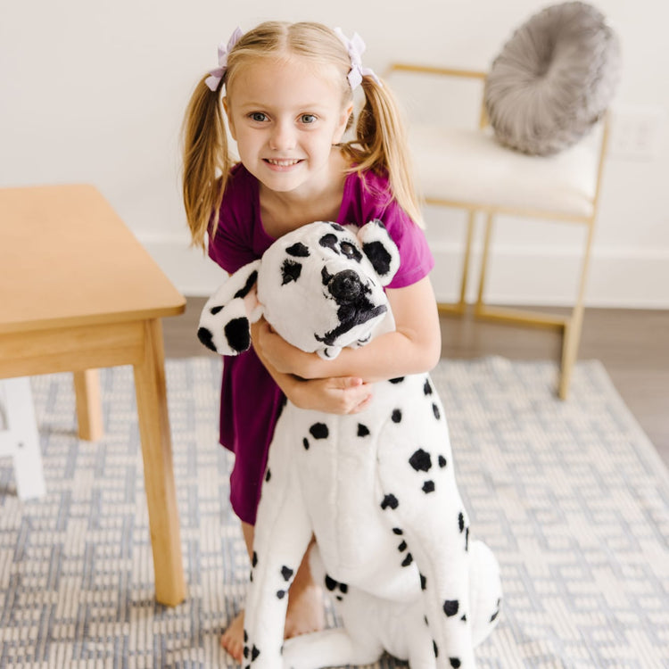 The front of the box for the Melissa & Doug Giant Dalmatian - Lifelike Stuffed Animal Dog (over 2 feet tall)