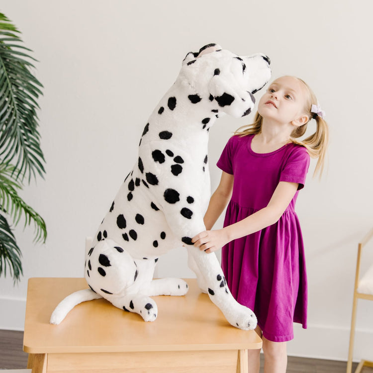 The front of the box for the Melissa & Doug Giant Dalmatian - Lifelike Stuffed Animal Dog (over 2 feet tall)