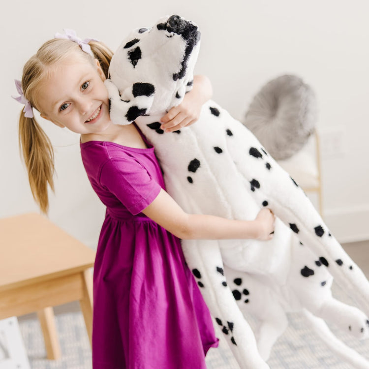 The front of the box for the Melissa & Doug Giant Dalmatian - Lifelike Stuffed Animal Dog (over 2 feet tall)