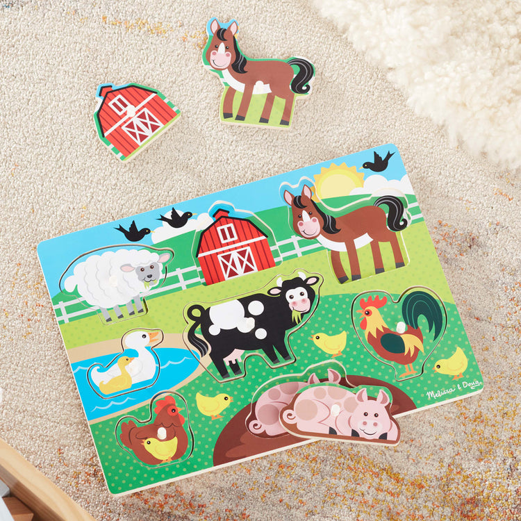 The front of the box for the Melissa & Doug Farm Wooden Peg Puzzle (8 pcs)