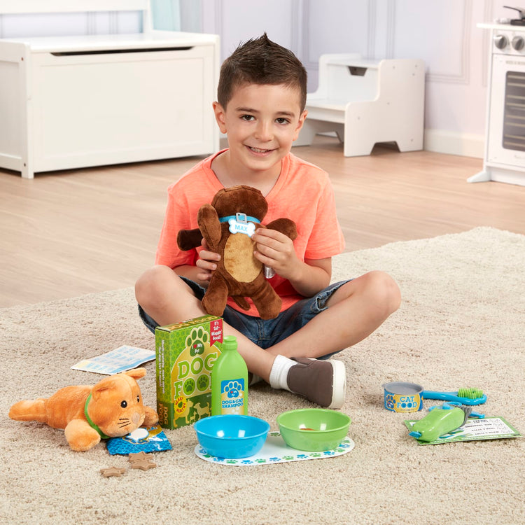 A kid playing with the Melissa & Doug Feeding and Grooming Pet Care Play Set
