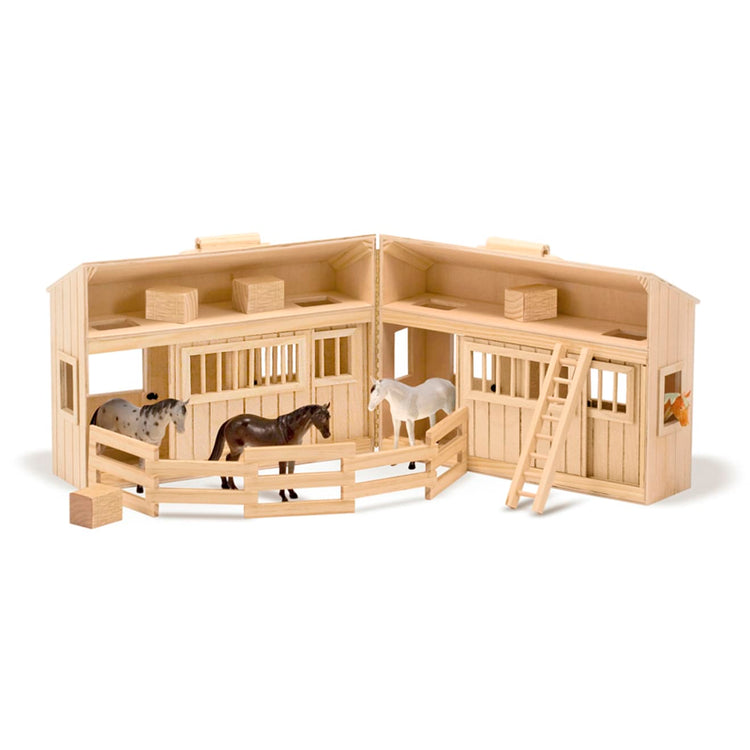 The loose pieces of the Melissa & Doug Fold and Go Wooden Horse Stable Dollhouse With Handle and Toy Horses (11 pcs)