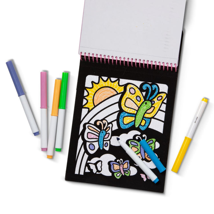 The front of the box for the Melissa & Doug On the Go Magic Velvet Pattern-Reveal Scenes Activity Kit - 6 Coloring Boards, 6 Markers