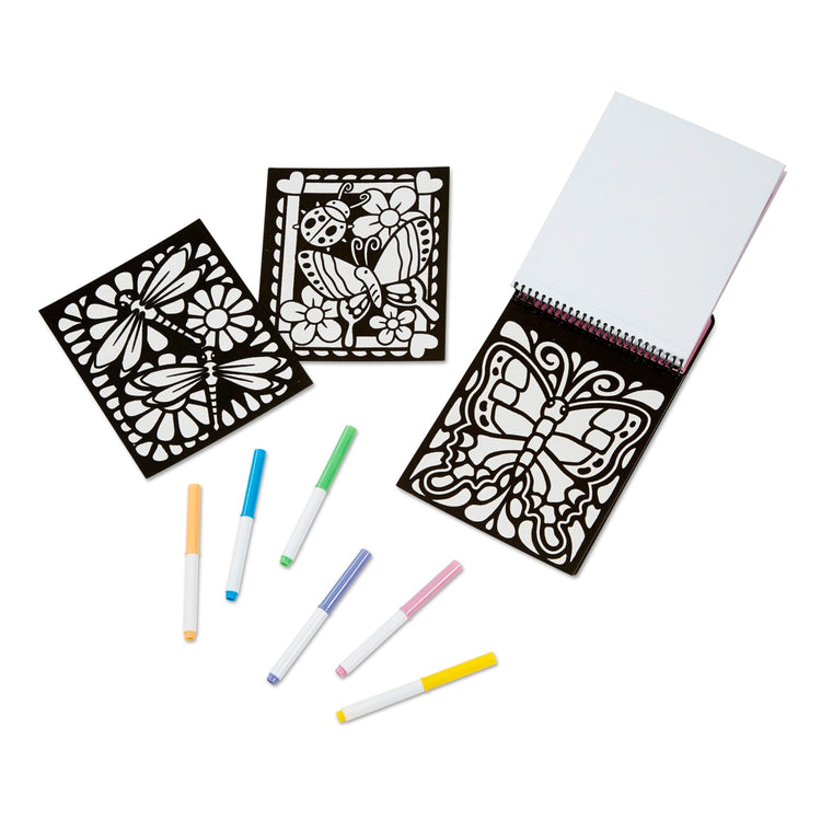 The loose pieces of the Melissa & Doug On the Go Magic Velvet Pattern-Reveal Scenes Activity Kit - 6 Coloring Boards, 6 Markers