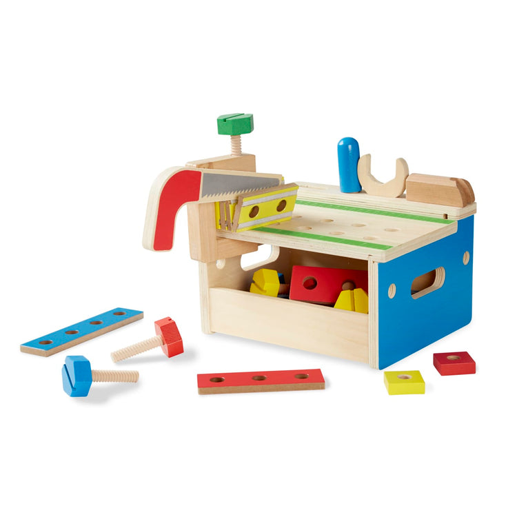 The loose pieces of the Melissa & Doug Hammer and Saw Tool Bench - Wooden Building Set (32 pcs)