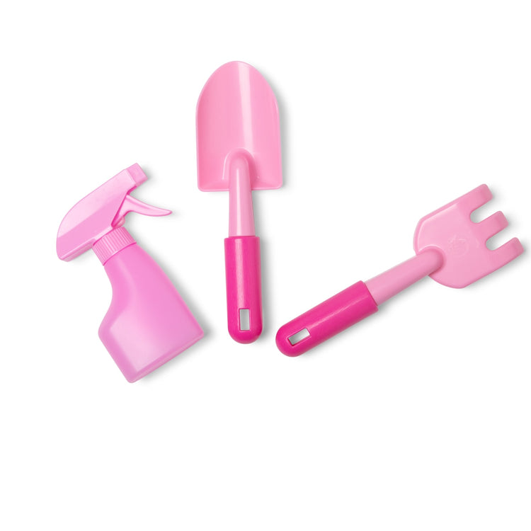 The loose pieces of the Melissa & Doug Sunny Patch Pretty Petals Gardening Tote Set With Tools
