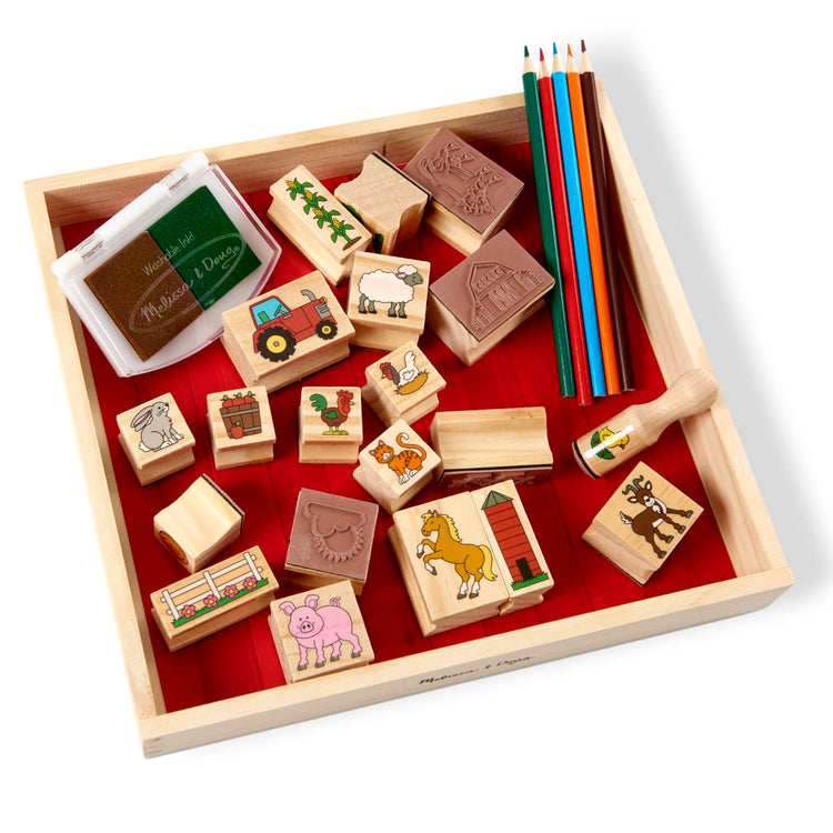The front of the box for the Melissa & Doug Stamp-a-Scene Wooden Stamp Set: Farm - 20 Stamps, 5 Colored Pencils, and 2-Color Stamp Pad