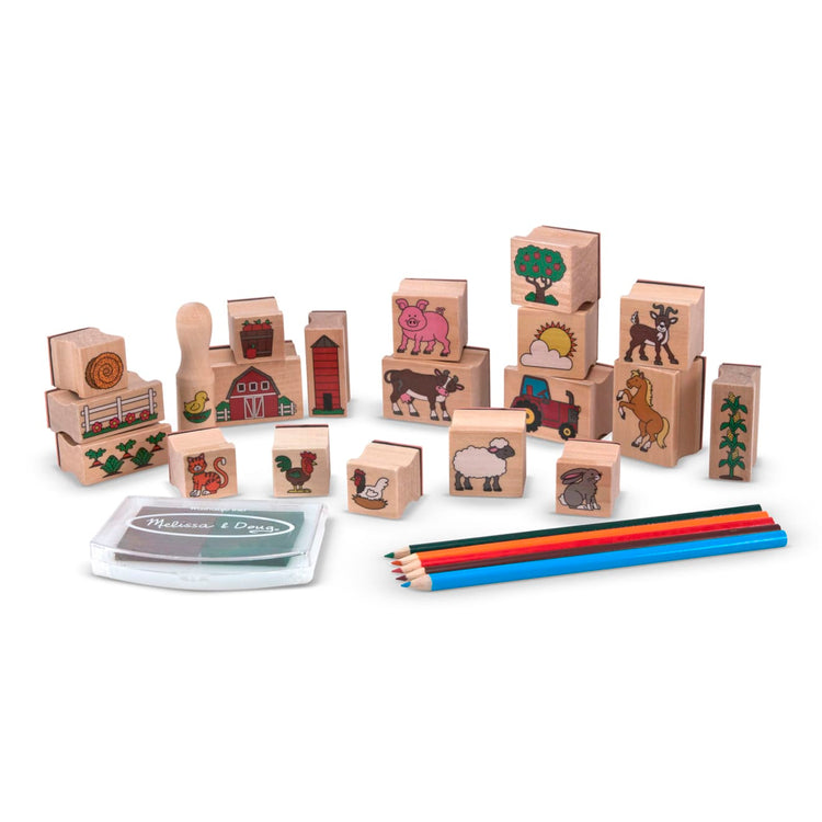 The loose pieces of the Melissa & Doug Stamp-a-Scene Wooden Stamp Set: Farm - 20 Stamps, 5 Colored Pencils, and 2-Color Stamp Pad